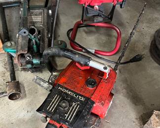 Chainsaw, car jack and floodlight