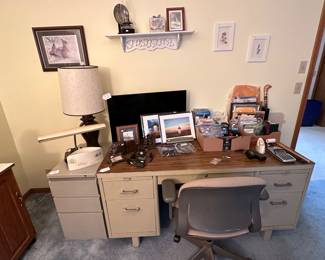 Overview metal desk ---- misc frames, office supplies. second bedroom 