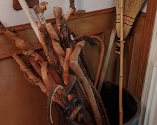 A lot of homemade walking sticks that are very unusual