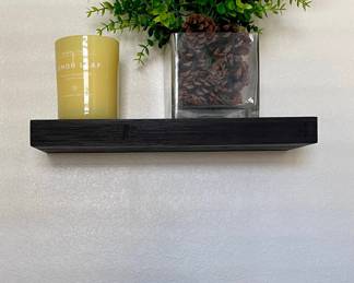 2 Dark Faux Wood Wall Shelves, Vase With Faux Plant, And A Lemon Leaf Candle