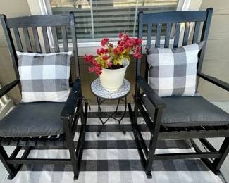 (2) Faux Wood Black Rockers With Cushions And A Mosaic And Metal Plant Stand With Planter With Checkered Rug