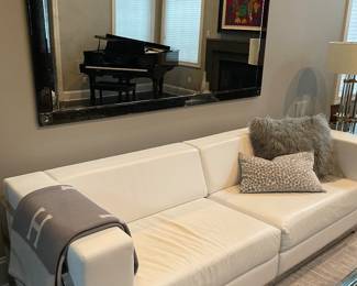 White leather couch Shown with 78” restoration hardware mirror