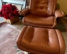 Super cool pink-ish leather chair, high-end rug