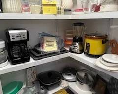 Pantry full of goodies - tupperware, crock pot, vintage ice cream maker, blender, coffee pots, bake ware