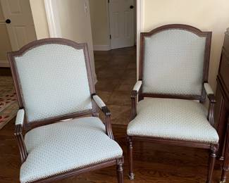 Mahogany chairs covered in a beautiful teal fabric.