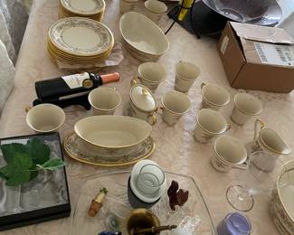 Lenox china, other china, Fostoria cups, and old glass pieces including fancy wine stoppers.