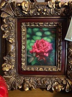 Ornate frame with rose