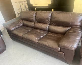39. Three-piece, brown leather couch set