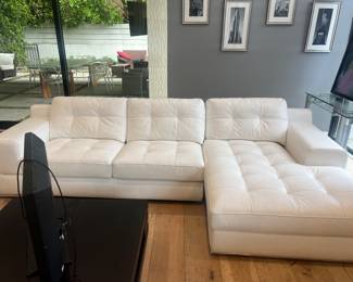 3. Part of white leather sectional