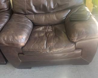 40. One of two plush armchairs, to leather couch set