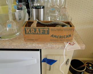It is a vintage Kraft cheese box, and it holds a vintage grinder