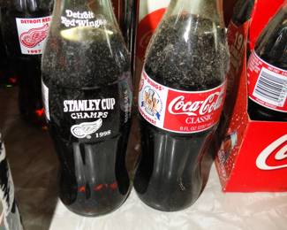Unopened Coca Cola bottles