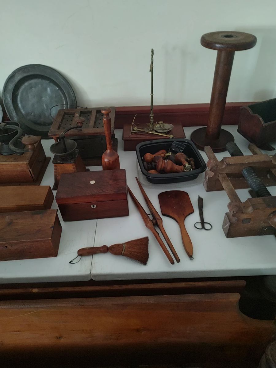 A selection of antique carved and turned wooden items located on the second floor.