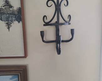 One of three handmade iron sconces possessing great detail and quality.