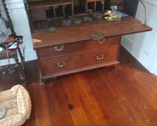 Mahogany British made refined campaign desk in two parts resting on a bracket base with inset brasses and developed interior top drawer secretary