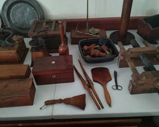 A selection of antique carved and turned wooden items located on the second floor.