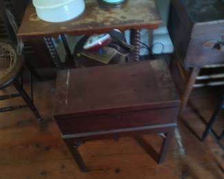 One of the several small tables and a mahogany British traveling letter/writing box on custom stand.