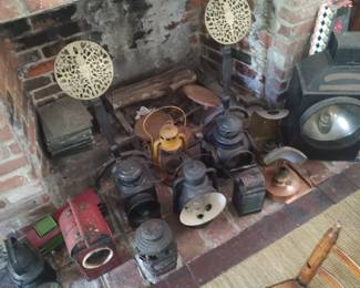 Various lanterns and fireplace items.