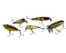 Five Vintage Bass Plug Fishing Lures Including C. C. B. Garrett Indiana Pike Lure, Fred Arrogast Jitterbug, Heddon Baby Zara Toad Lure and More!
