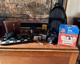 Vintage binoculars, cameras, drop leaf table