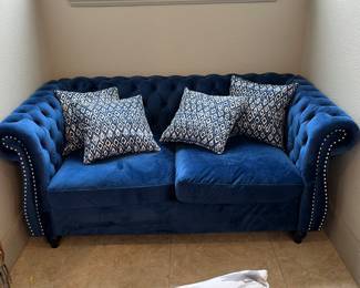 blue rolled arm, tufted button love seat with nail head trim