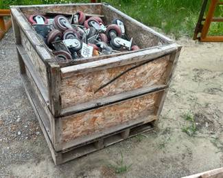 LARGE WOODEN CRATE OF CASTER WHEELS