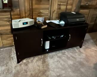 This picture came out really dark, but that’s a nice black entertainment center and there’s a wonderful Bose radio & CD player on top that we even have the remote to!