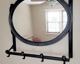 Wall mirror with rack