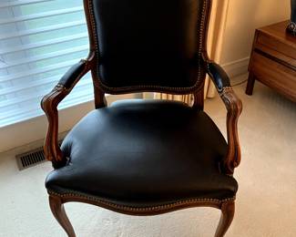 Black leather style and perfection!  Solid wood trim, this chair is like new!