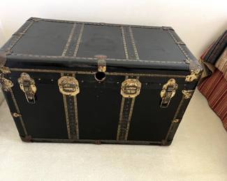 Late 19th Century trunk is certainly a conversation piece!  In very good condition and will provide lots of storage room for blankets, clothes, etc.