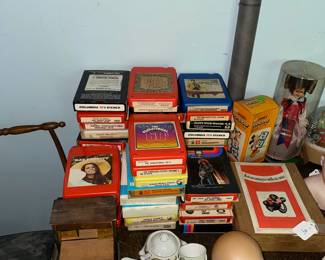 8 track tapes , tea sets, dolls