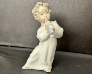 Lladro angel playing a flute