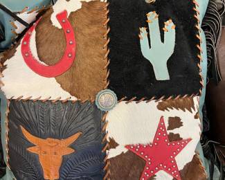 Cute Western inspired pillow with leather fringe, cowhide and suede accents.