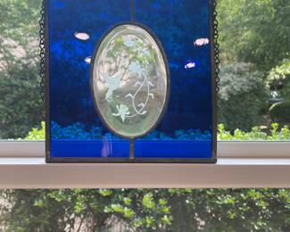 Beautiful stained glass window piece in cobalt blue with etched floral centerpiece. NOTE: white spots on blue area is reflection from kitchen lights. This piece is in perfect condition!