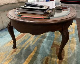 Oval coffee table with glass inserts