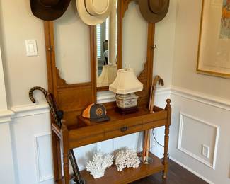 Mirrored  entry umbrella/ hat stand with center drawer and metal drip trays on base.