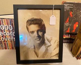 An early Elvis photo that he signed (and two cigarette butts of his to go with)