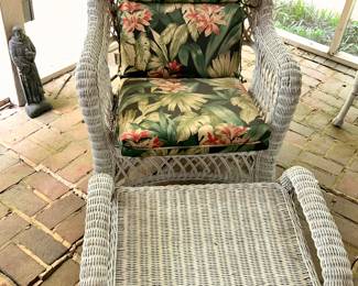 Wicker chair with ottoman.