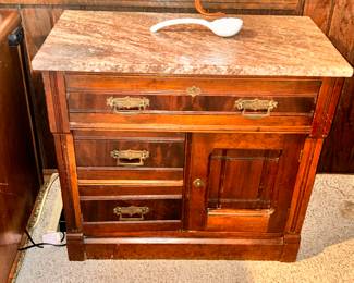 Washstand with marble top.