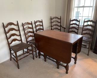 GATELEG TABLE WITH 3 LEAVES AND 6 LADDER BACK CHAIRS