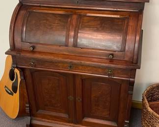  Antique Walnut Cylinder Roll Top Desk.  Beautiful carved edge on three sides of top.