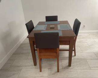 Solid Oak Table and 4 leather chairs.