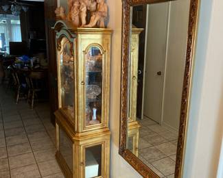 Lighted Gold curio cabinet and large gold leaf mirror