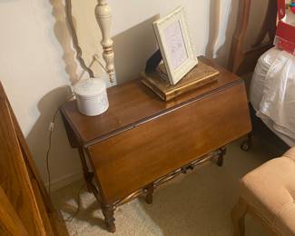 One of the pair of gate leg side tables