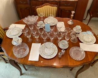 French provincial formal dining room table with two leaves, four side chairs, and two armchairs also had protective cover made to fit