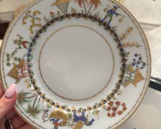 French Tiffany & Company salad plate in the Cirque Chinois Le Tallec pattern. Hand-painted gilt trim and encircling Orientalist botanical and architectural designs with a yellow dragon. It features a hand-inscribed maker's mark on the underside: TIFFANY & CO PRIVATE STOCK HAND PAINTED MADE IN FRANCE and numbered