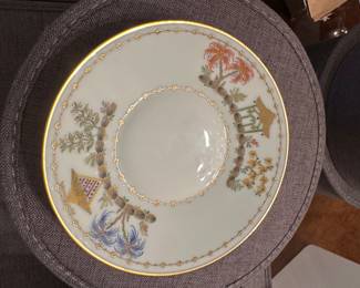 Entire set of French Tiffany & Company China. Shown is a saucer plate in the Cirque Chinois Le Tallec pattern. Hand-painted gilt trim and encircling Orientalist botanical and architectural designs with a yellow dragon. It features a hand-inscribed maker's mark on the underside: TIFFANY & CO PRIVATE STOCK HAND PAINTED MADE IN FRANCE 04/223 