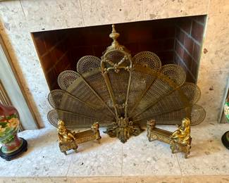 If the antique brass peacock fire screen doesn’t snatch your entire attention, check out these antique 19th c. cherub andirons holding down the fort! 