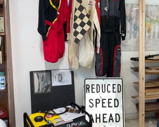 Racing suits, street sign and generator..