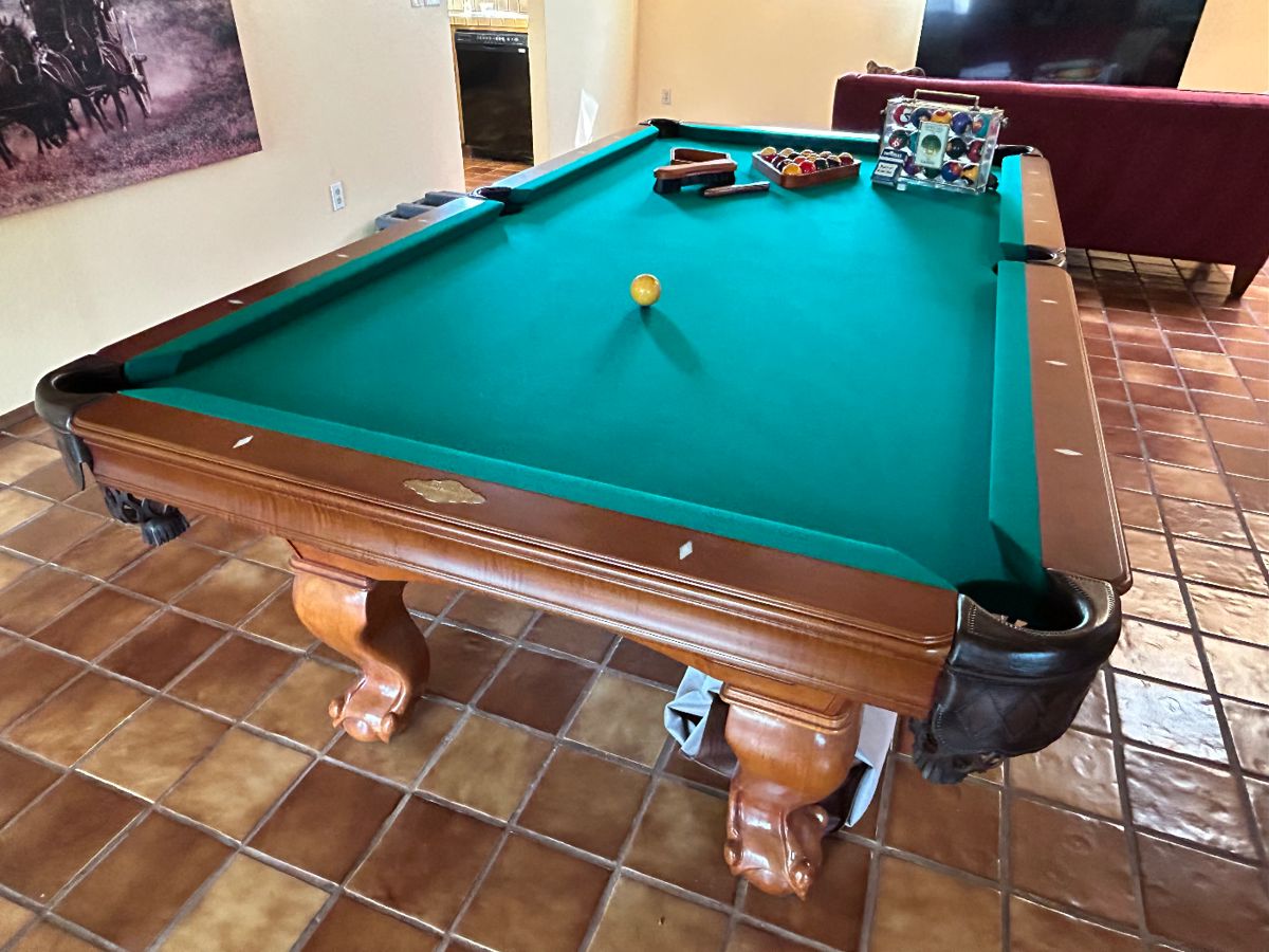 Beautiful  Imperial International billiards table with mother of pearl sights and hand carved legs. Must see !  Schedule your tuck and movers for the amazing find. 